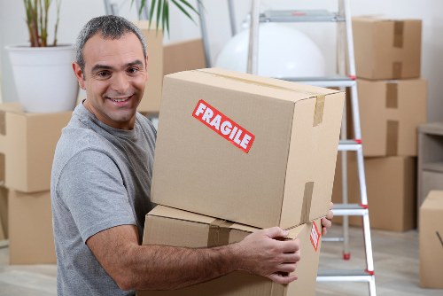 Local team collecting sofas and other furniture from a flat in Earls Court