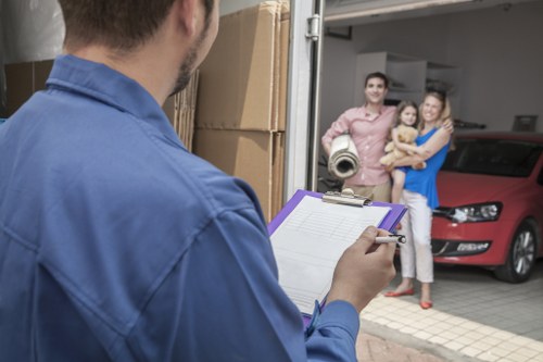 Movers loading boxes and furniture for a Earls Court relocation
