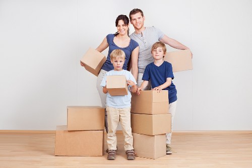 Removal team planning a home move in an Earls Court street