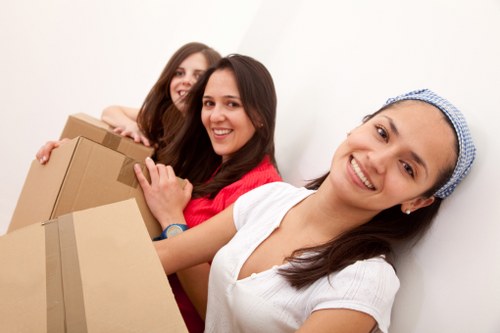 Loading furniture into a moving truck in Earls Court