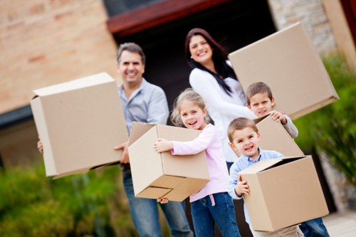 Household items being unloaded at a new home near Earls Court