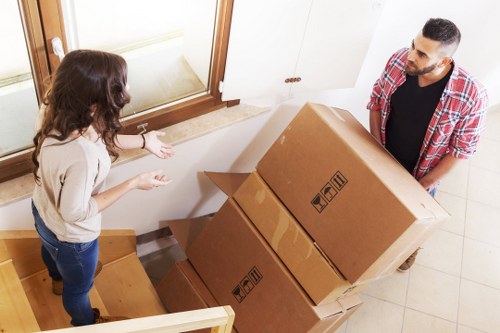 Packed boxes and furniture ready for loading into a removals van