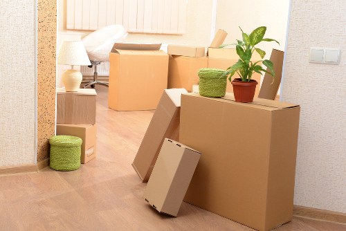 Packed office furniture and files prepared for a business move