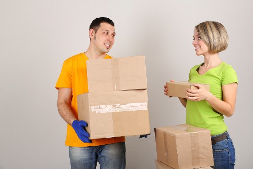 Unpacking support helping a family settle into a new Earls Court flat